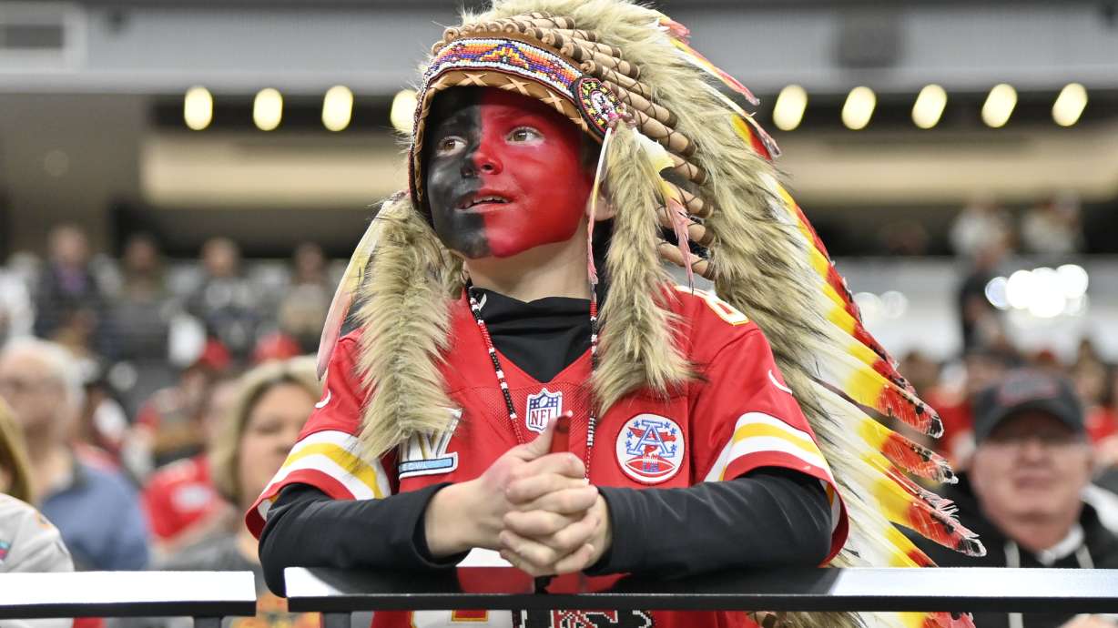 FILE - A young Kansas City Chiefs fan, dressed with a headdress and face paint, looks on during an NFL football game against the Las Vegas Raiders, Sunday, Nov. 26, 2023, in Las Vegas.