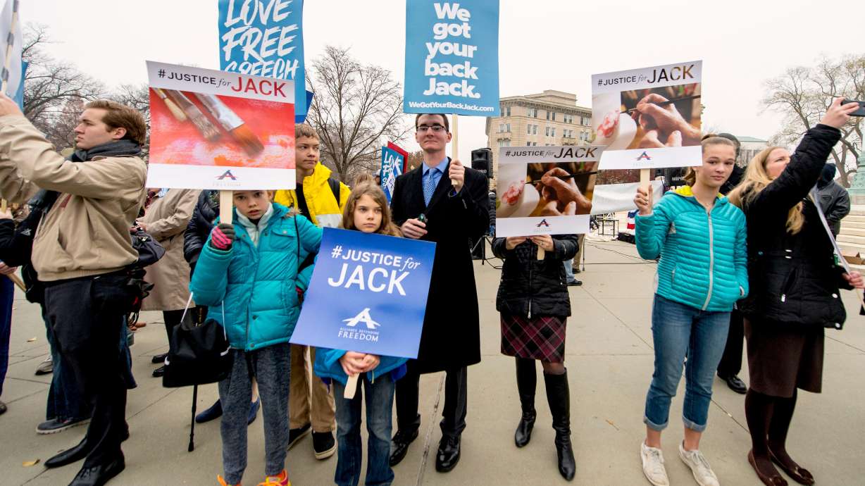 People demonstrate outside the United States Supreme Court on Dec. 5, 2017. The Colorado Supreme Court dismissed a case against Jack Phillips involving baking a cake for a transgender woman.