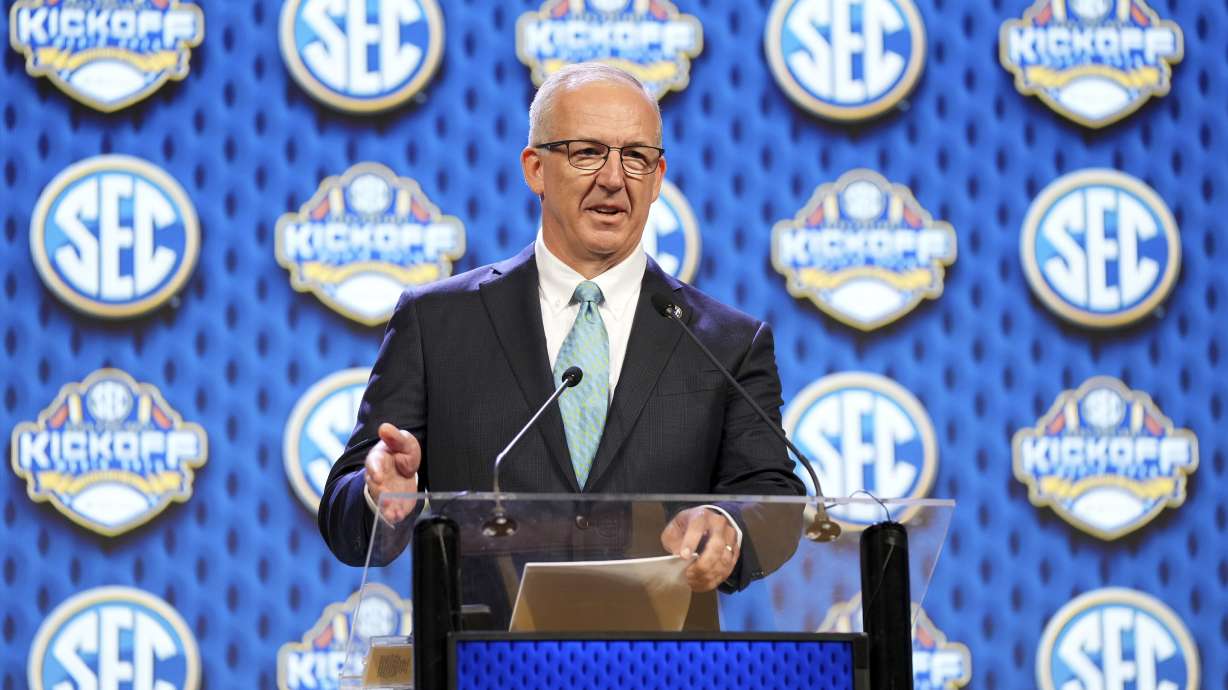 FILE - Southeastern Conference commissioner Greg Sankey speaks during SEC NCAA college football media days, July 15, 2024, in Dallas.