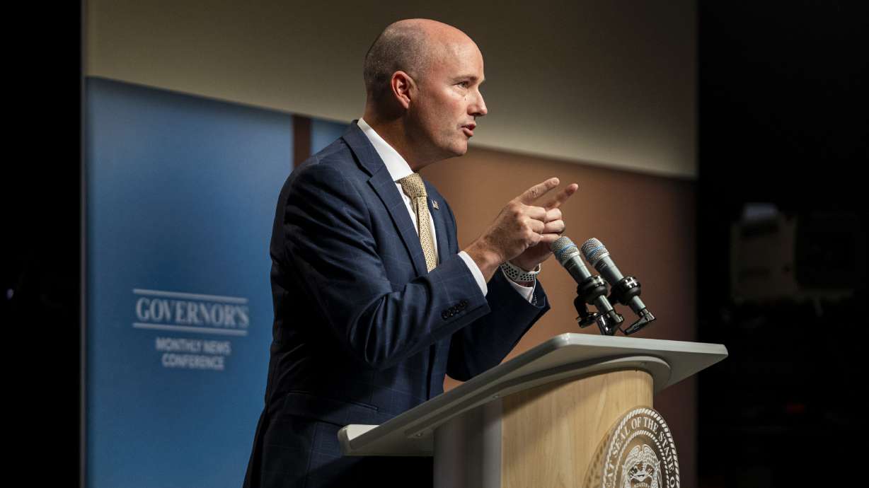 Utah Gov. Spencer Cox speaks at his monthly news conference in Salt Lake City on Sept. 19. Cox and 24 other governors are pressing the Biden administration for details on Venezuelan, Haitian and other parolees allowed into the country.