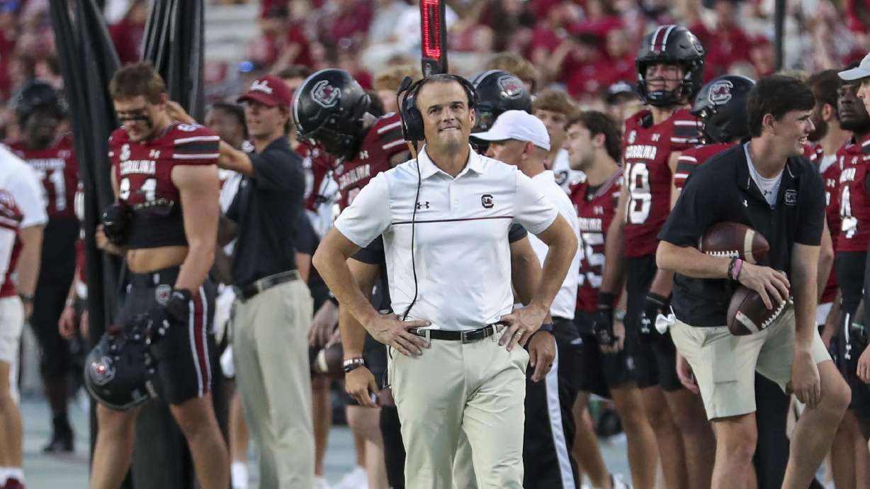 South Carolina head coach Shane Beamer works at an NCAA college football game Oct. 5 in Columbia, S.C. College football is on high alert for players flashing make-believe guns at an opponent.