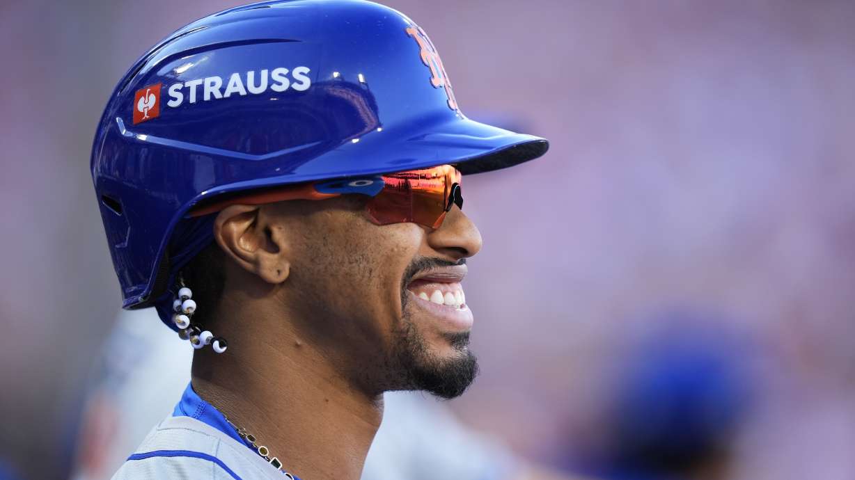 New York Mets' Francisco Lindor smiles during of the first inning of Game 2 of a baseball NL Division Series against the Philadelphia Phillies, Sunday, Oct. 6, 2024, in Philadelphia.