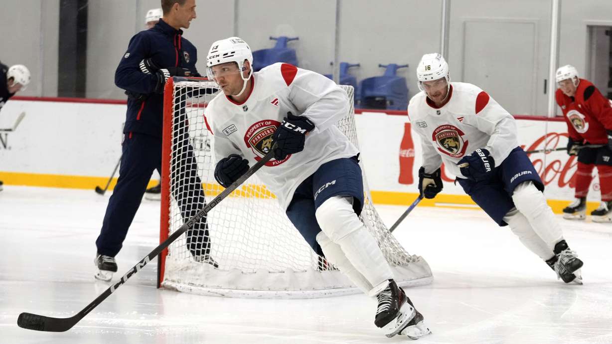 Florida Panthers center Carter Verhaeghe, left, and center Aleksander Barkov, right, skate during NHL hockey training camp Thursday, Sept. 19, 2024, in Fort Lauderdale, Fla.