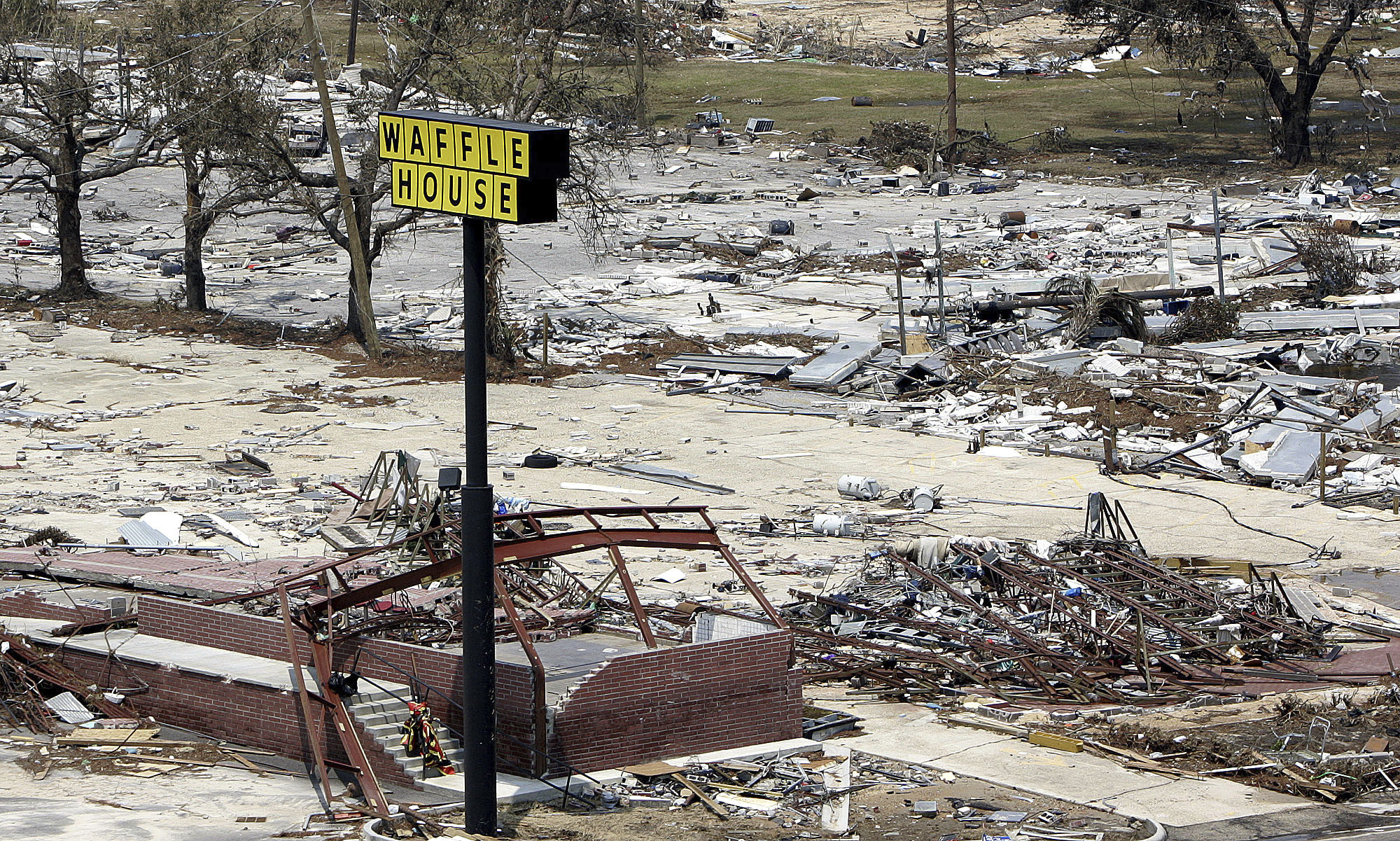 A sign is all that's left of this Waffle House on the beach in Gulfport, Miss., Aug. 31, 2005, following Hurricane Katrina. Seven of the locations were destroyed during Katrina.