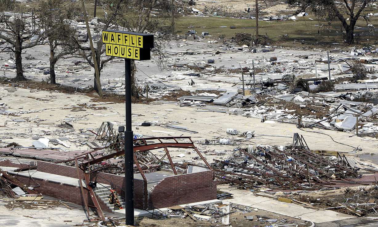 A sign is all that's left of this Waffle House on the beach in Gulfport, Miss., Aug. 31, 2005, following Hurricane Katrina. Seven of the locations were destroyed during Katrina.