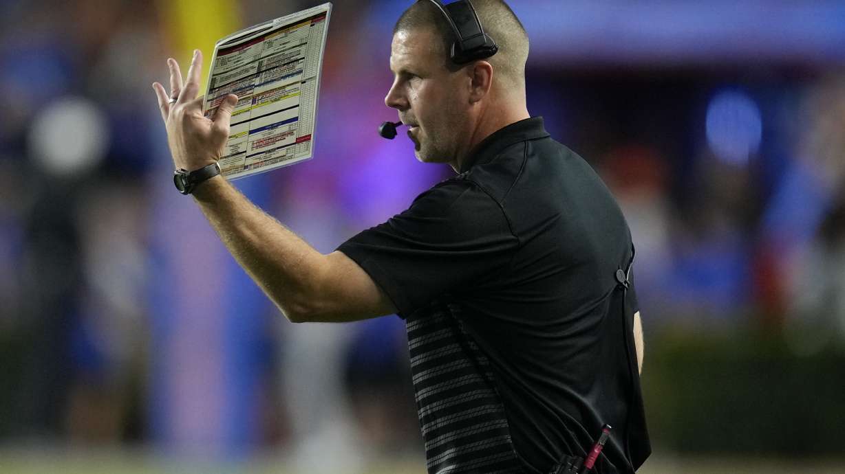 Florida head coach Billy Napier signals to his players during the first half of an NCAA college football game against Central Florida, Saturday, Oct. 5, 2024, in Gainesville, Fla.