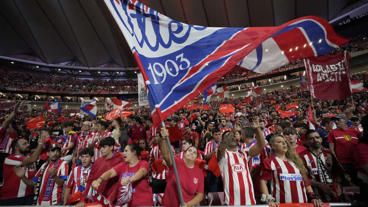 Atletico fans cheer before the La Liga soccer match between Atletico Madrid and Real Madrid at the Metropolitano stadium in Madrid, Spain, Sunday, Sept. 29, 2024.