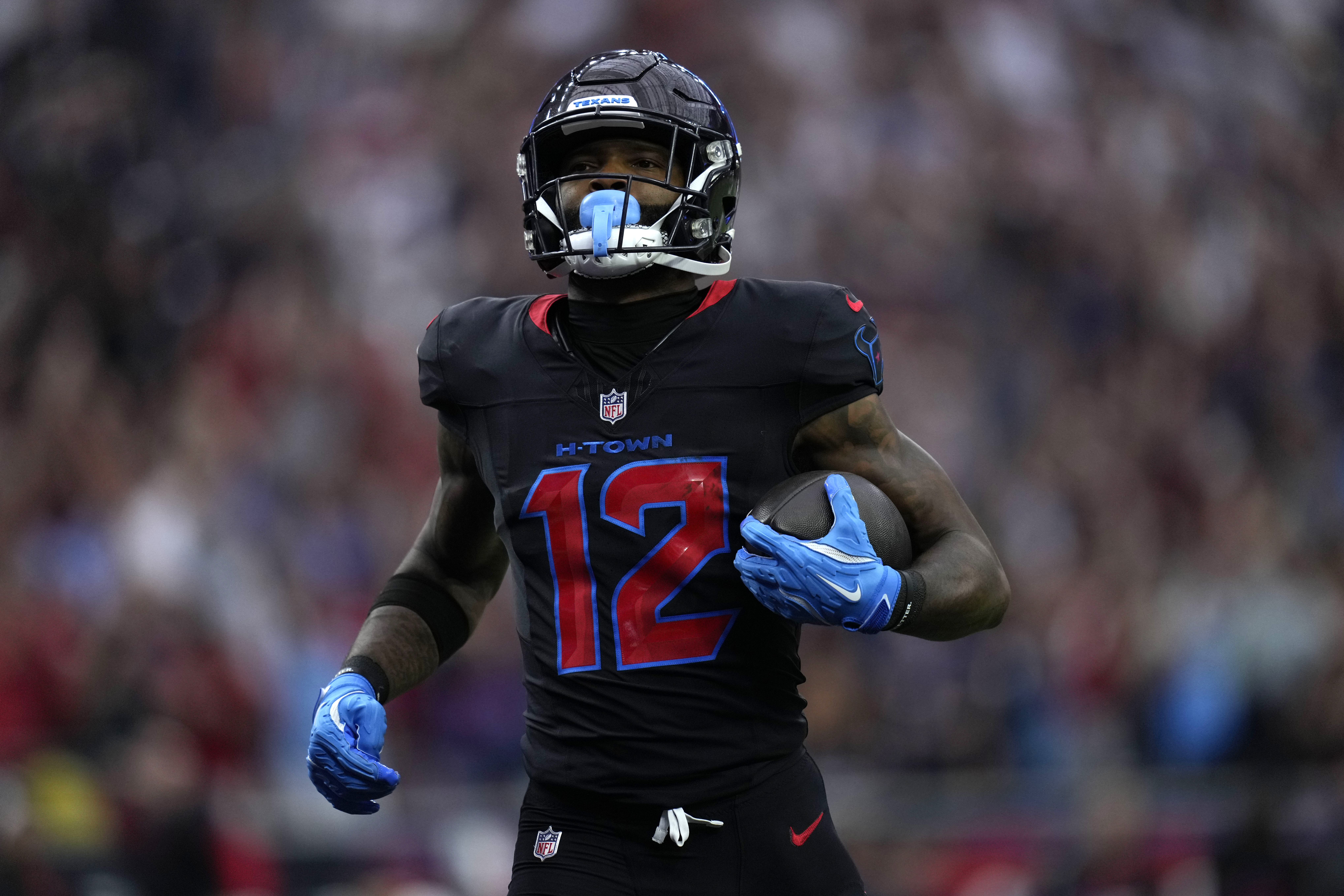 Houston Texans wide receiver Nico Collins scores on a 67-yard touchdown reception during the first half of an NFL football game Buffalo Bills, Sunday, Oct. 6, 2024, in Houston.