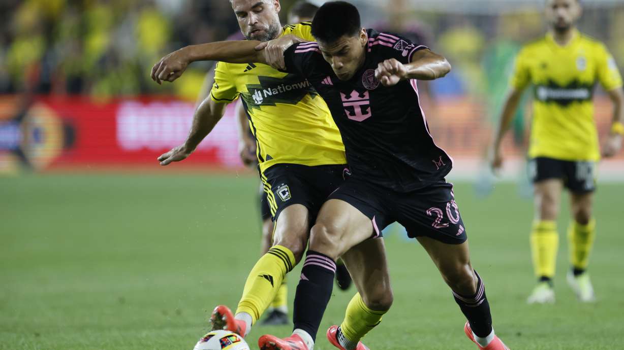 Inter Miami's Diego Gomez, right, and Columbus Crew's Rudy Camacho chase the ball during the first half of an MLS soccer match Wednesday, Oct. 2, 2024, in Columbus, Ohio.