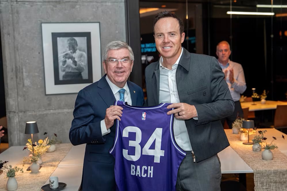 During a tour of the Delta Center, Ryan Smith, right, gave a presentation on the future vision for downtown Salt Lake City and how the 2034 Olympic and Paralympic Games will benefit from this development. International Olympic Committee President Thomas Bach stands on the left.