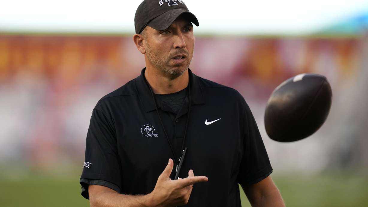 Iowa State head coach Matt Campbell tosses a football before an NCAA college football game against Baylor, Saturday, Oct. 5, 2024, in Ames, Iowa.