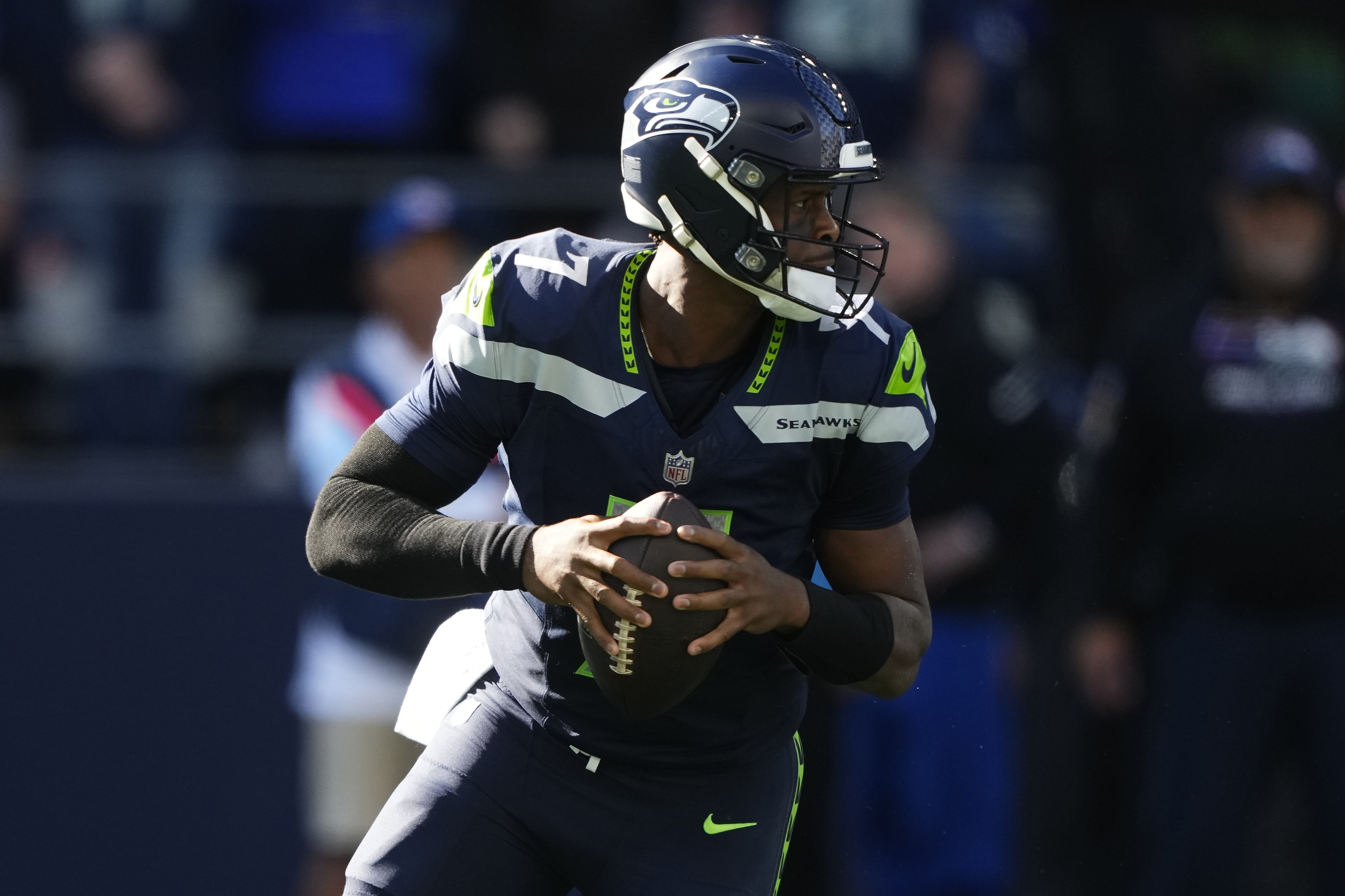 Seattle Seahawks quarterback Geno Smith (7) looks to pass during the second half of an NFL football game against the New York Giants, Sunday, Oct. 6, 2024, in Seattle.