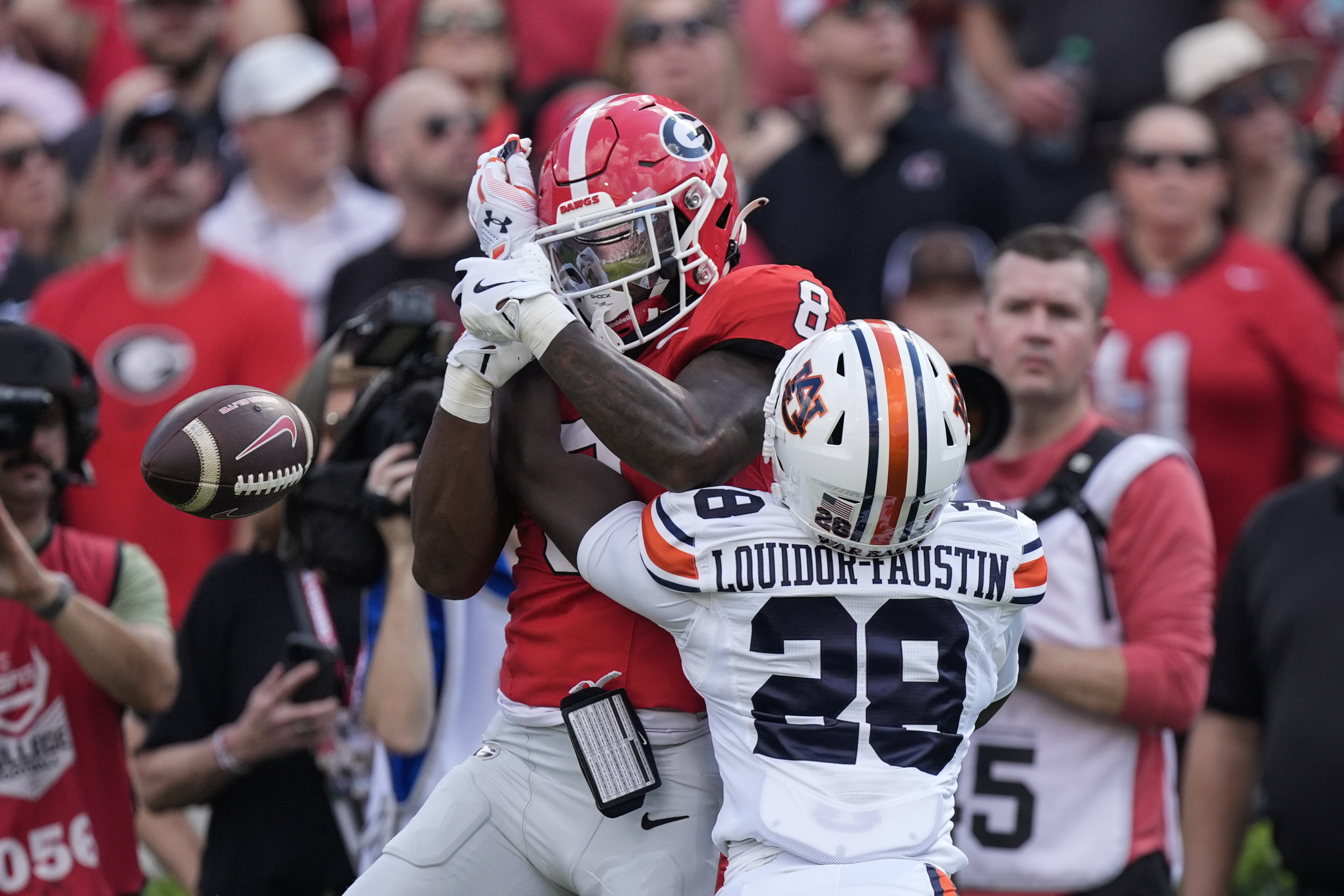 Auburn safety Kensley Louidor-Faustin (28) breaks up a pass intended for Georgia wide receiver Colbie Young (8) in the first half of an NCAA college football game Saturday, Oct. 5, 2024, in Athens, Ga.