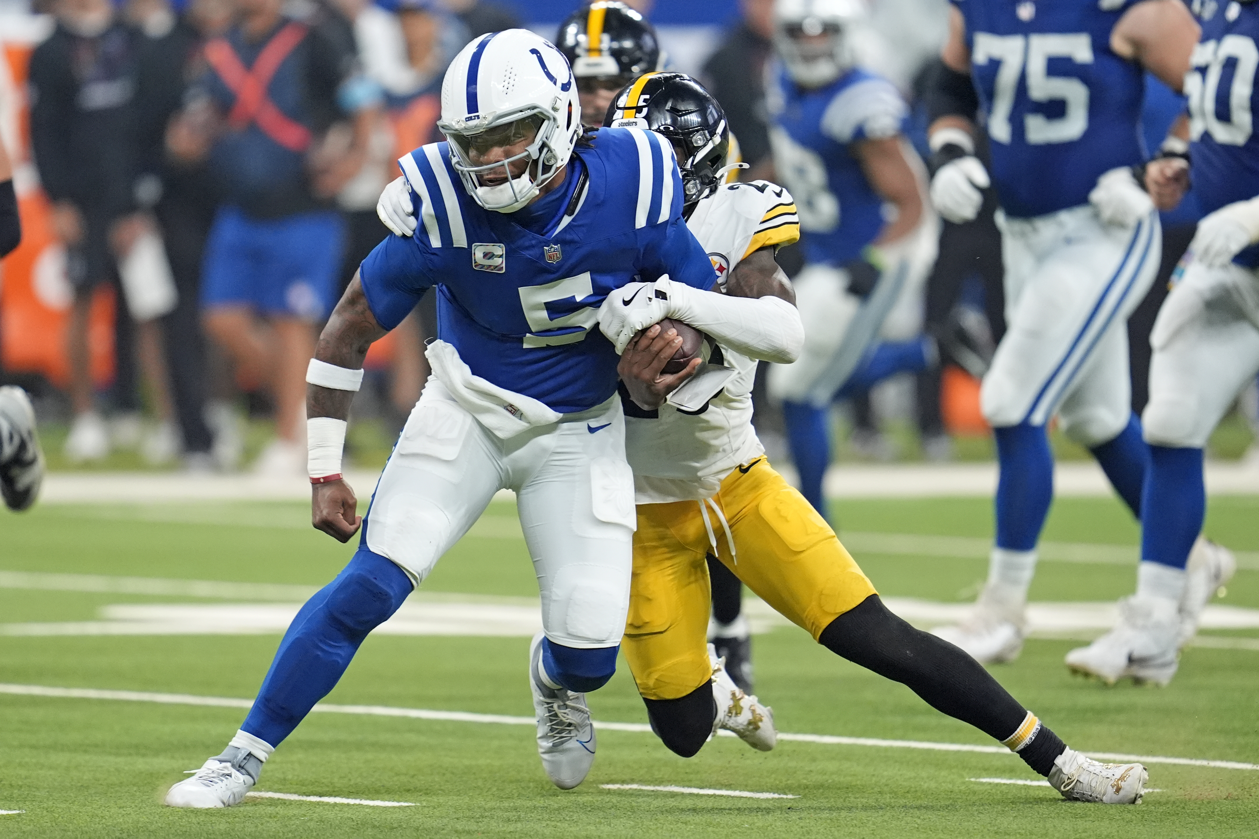 Indianapolis Colts quarterback Anthony Richardson (5) is tackled by Pittsburgh Steelers safety DeShon Elliott (25) during the first half of an NFL football game Sunday, Sept. 29, 2024, in Indianapolis. Richardson left the game after this play with an injury after this play.