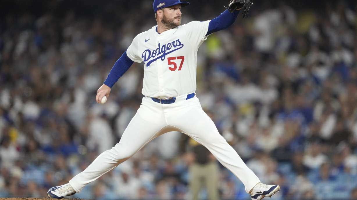 Los Angeles Dodgers pitcher Ryan Brasier throws to a San Diego Padres batter during the eighth inning in Game 2 of a baseball NL Division Series, Sunday, Oct. 6, 2024, in Los Angeles.
