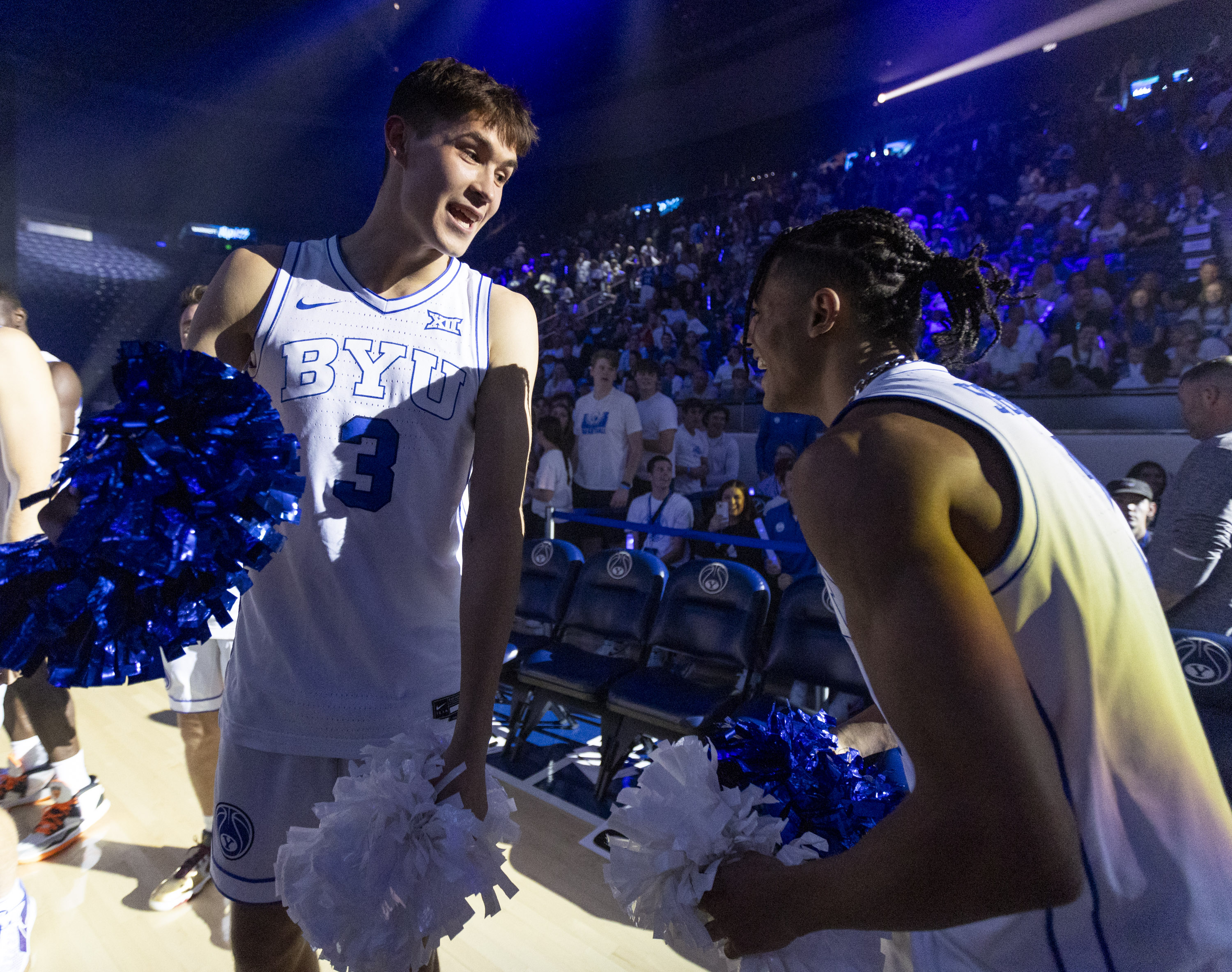 Brigham Young teammates Egor Demin (3) and Trey Stewart (1) laugh with each other while playing with borrowed cheerleading squads during Marriott Madness on Thursday, Oct. 3, at the Marriott Center on the campus of Brigham Young University in Provo. Pompoms cheer. 2024.