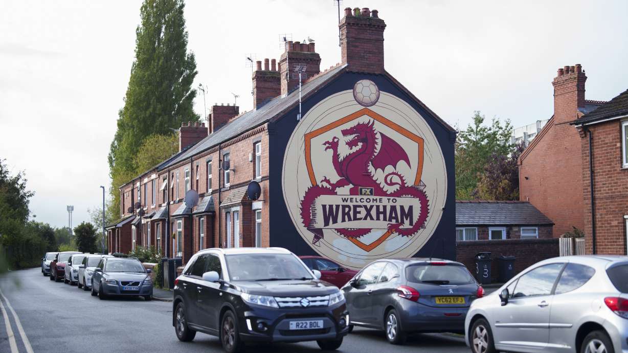 A "Welcome to Wrexham" mural adorns the wall of a residential house in Wrexham, Wales, Monday, Oct. 7, 2024.