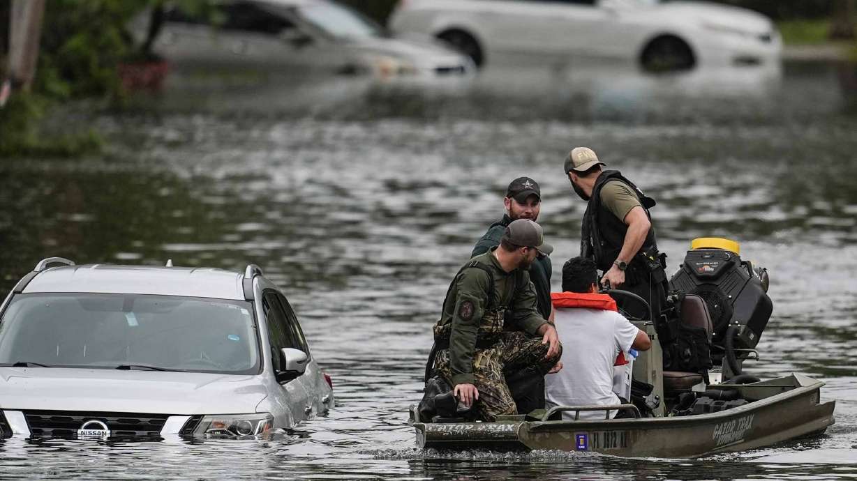 People are rescued from an apartment complex in the aftermath of Hurricane Milton, Thursday in Clearwater, Fla.