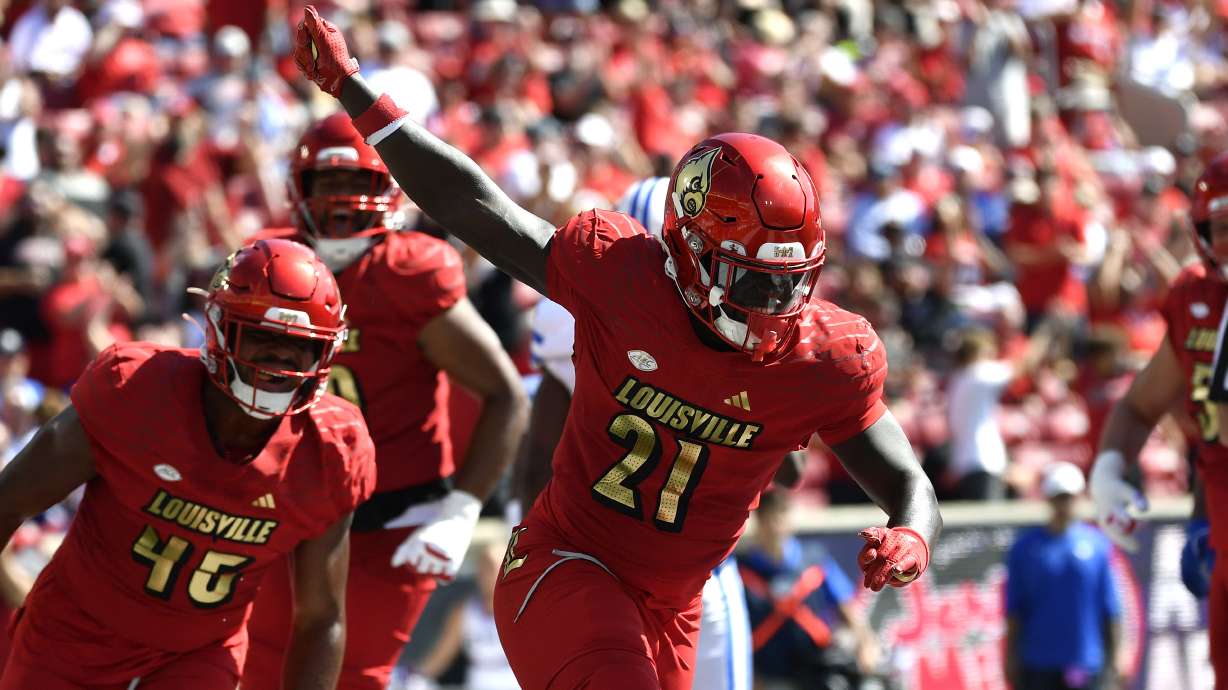 Louisville running back Donald Chaney (21) celebrates after scoring a touchdown during the second half of an NCAA college football game against SMU in Louisville, Ky., Saturday, Oct. 5, 2024.