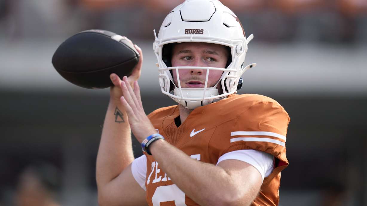 Texas quarterback Quinn Ewers (3) throws before an NCAA college football game against UTSA in Austin, Texas, Saturday, Sept. 14, 2024.