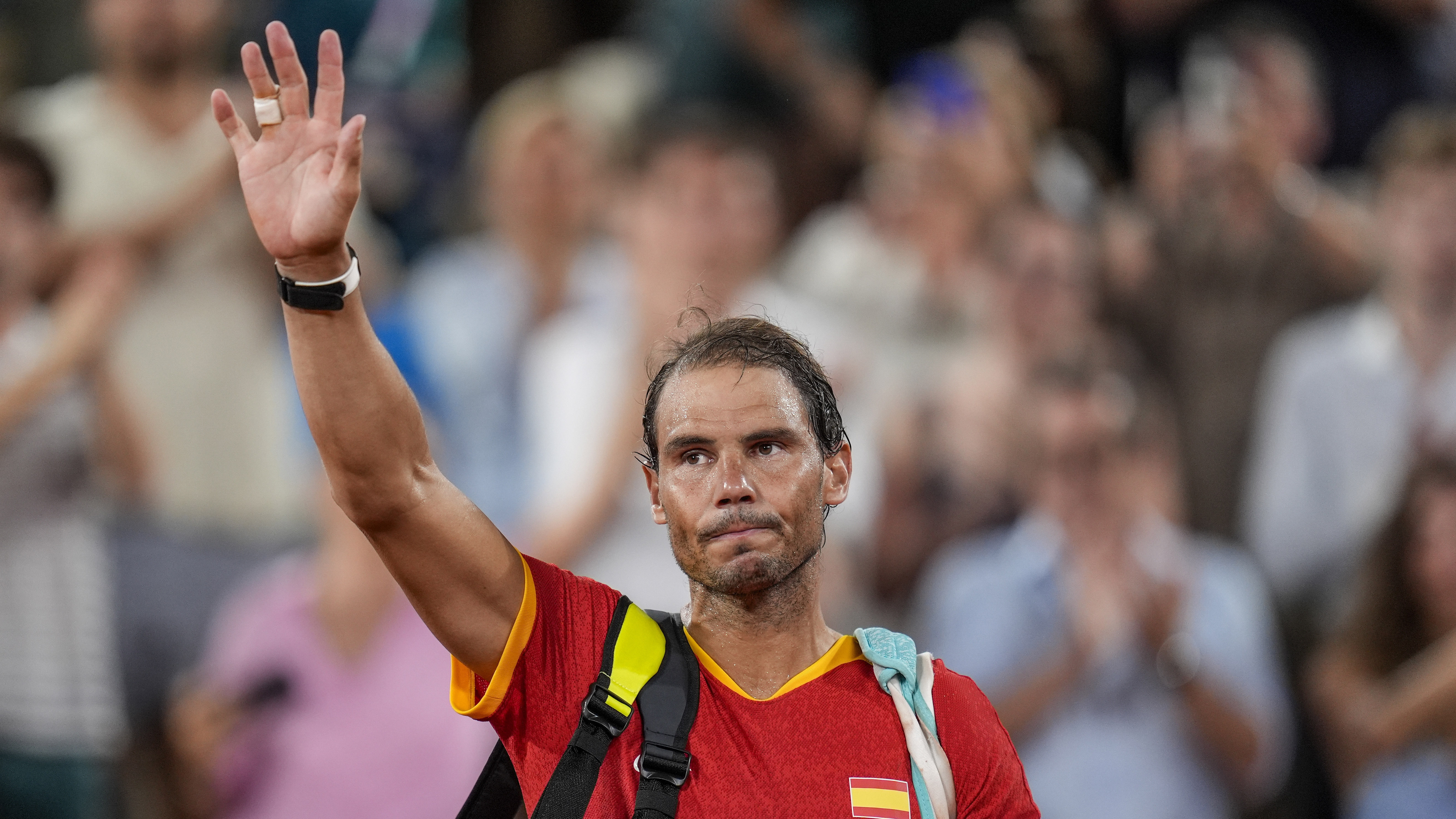 FILE - Rafael Nadal reacts waves after the men's doubles quarter-final tennis competition at the Roland Garros stadium, at the 2024 Summer Olympics, July 31, 2024, in Paris, France.