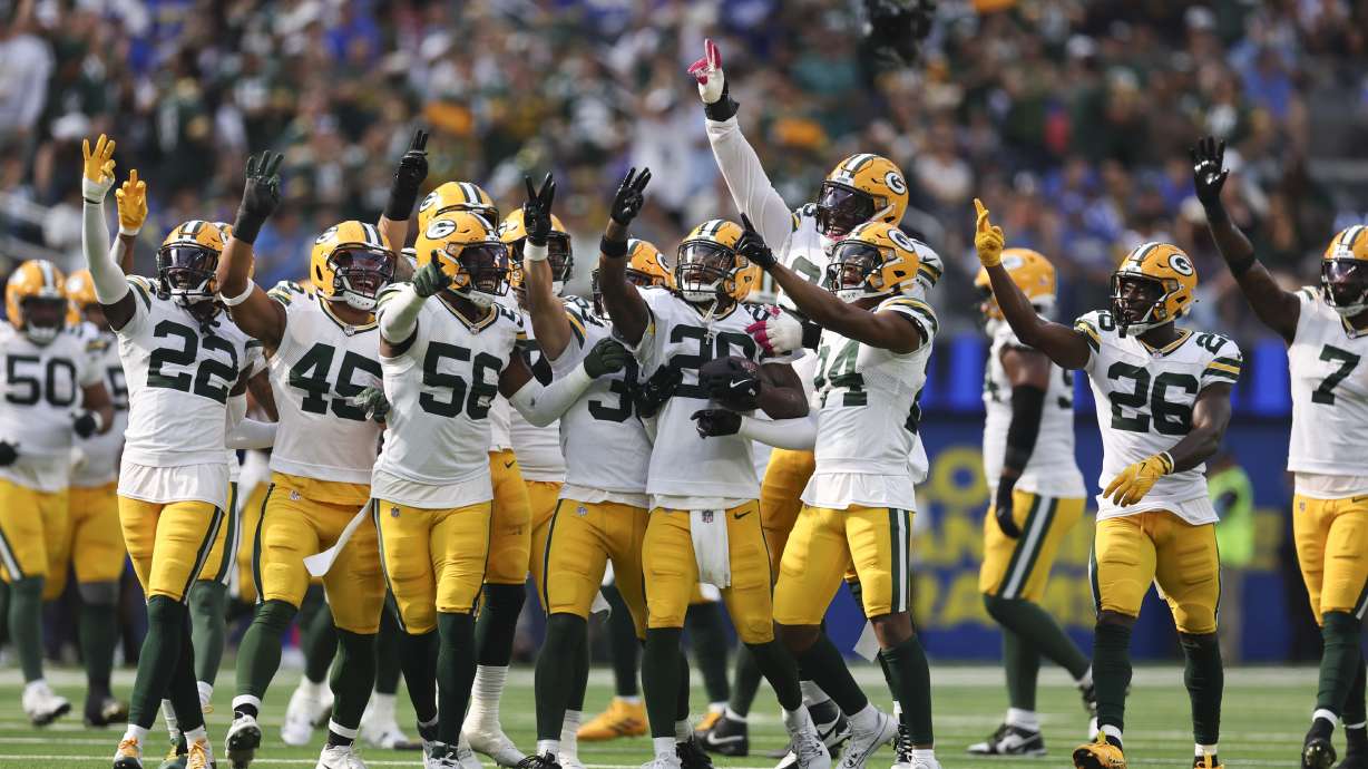 Green Bay Packers players celebrate an interception by safety Xavier McKinney (29) during the second half of an NFL football game against the Los Angeles Rams Sunday, Oct. 6, 2024, in Inglewood, Calif.