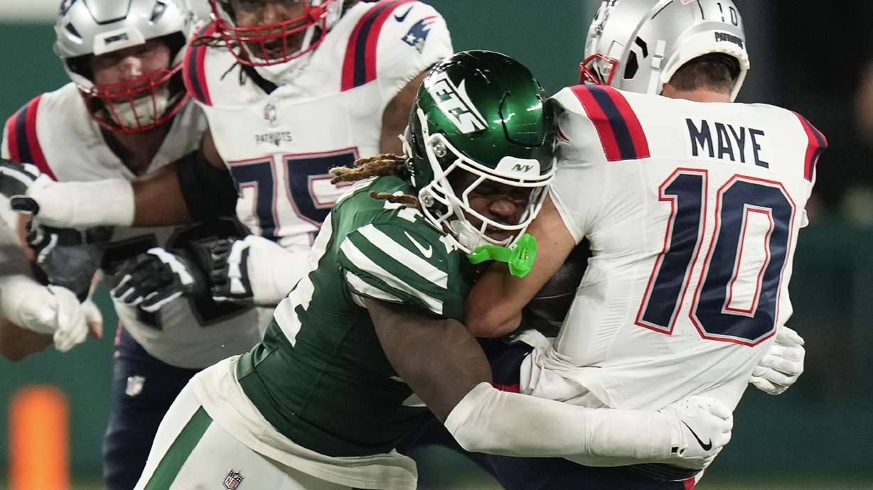 New York Jets linebacker Jamien Sherwood (44) sacks New England Patriots quarterback Drake Maye (10) during the fourth quarter of an NFL football game, Thursday, Sept. 19, 2024, in East Rutherford, N.J.