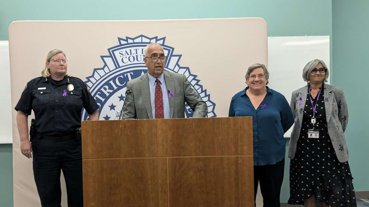 Salt Lake District Attorney Sim Gill, second from left, speaks to the press about domestic violence. He is joined by West Valley City Police Chief Colleen Jacobs, left; Utah Coalition Against Sexual Assault program manager Susan Chasson, second from right; and Asha Parekh, director of the Survivor and Victim Services Division within the Salt Lake County District Attorney's Office.