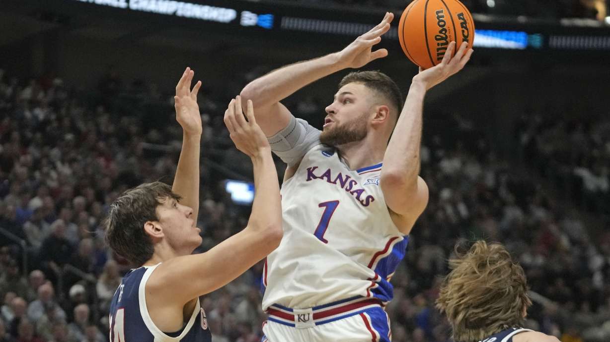 FILE - Kansas center Hunter Dickinson (1) shoots as Gonzaga forward Braden Huff (34) defends during the first half of a second-round college basketball game in the NCAA Tournament in Salt Lake City, Saturday, March 23, 2024.