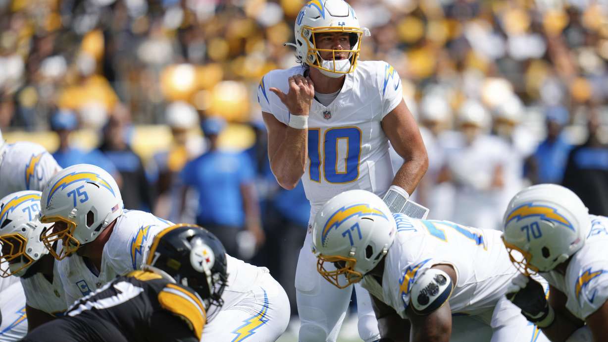 Los Angeles Chargers quarterback Justin Herbert (10) audibles at the line of scrimmage during the first half of an NFL football game against the Pittsburgh Steelers, Sunday, Sept. 22, 2024, in Pittsburgh.