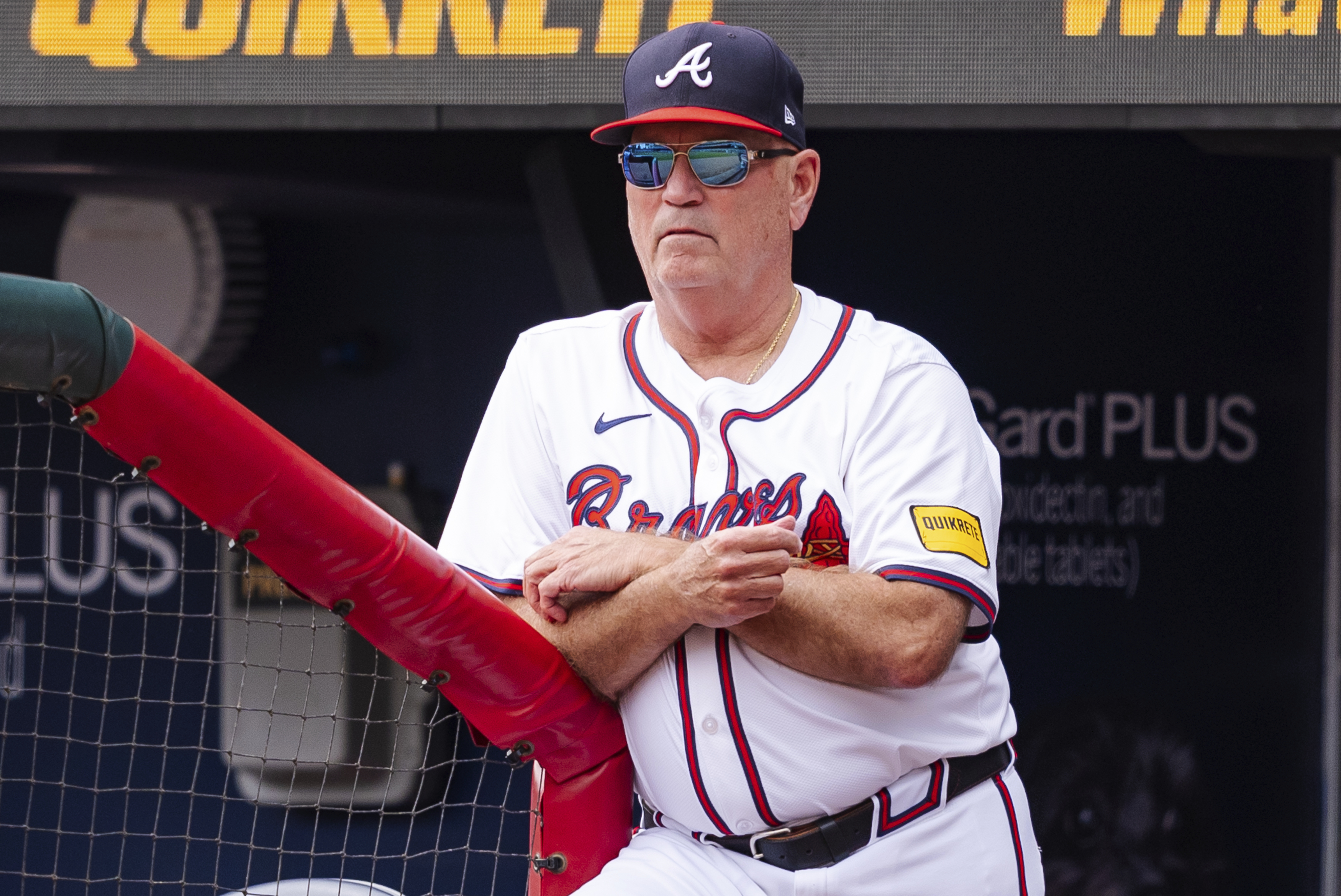 Atlanta Braves manager Brian Snitker watches from the dugout in the third inning of a baseball game against the New York Mets, Monday, Sept. 30, 2024, in Atlanta.