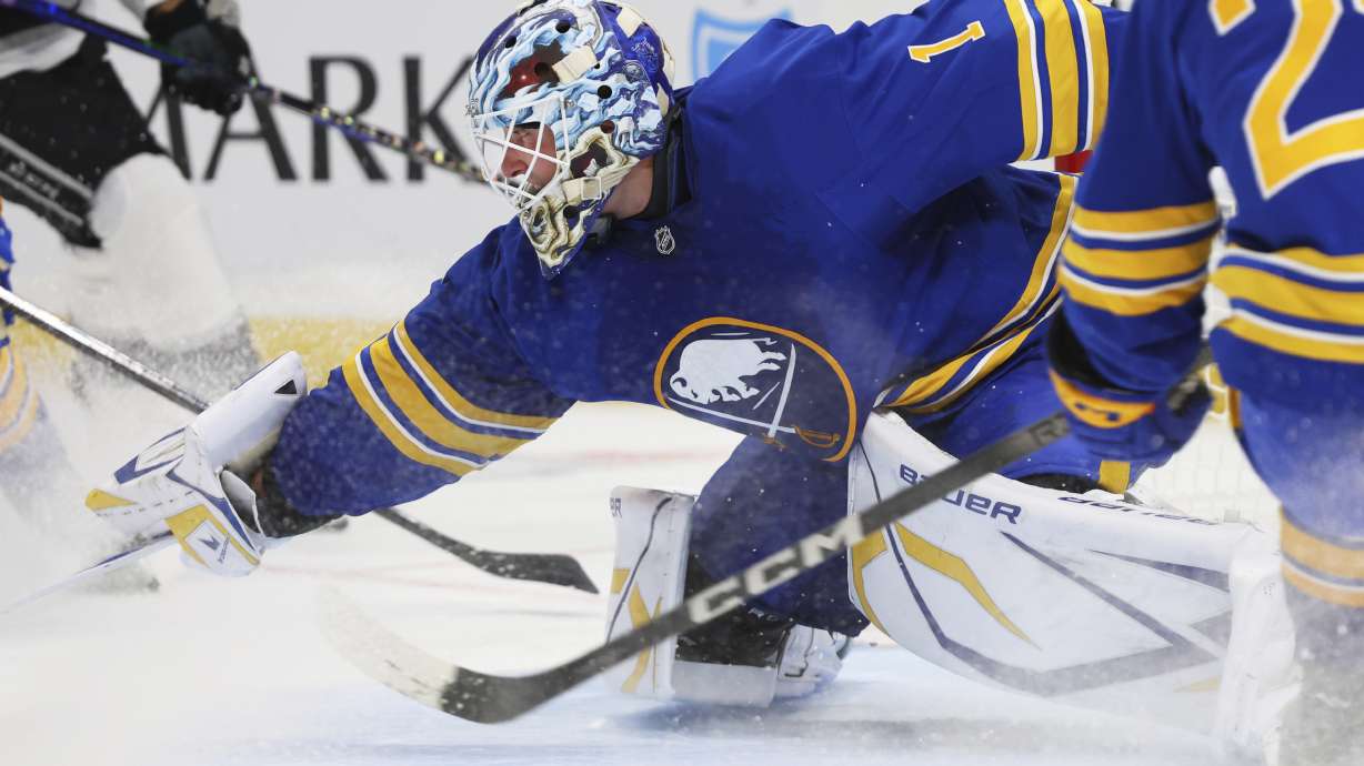 Buffalo Sabres goaltender Ukko-Pekka Luukkonen (1) poke-checks the puck during the second period of an NHL hockey game against the Los Angeles Kings, Thursday, Oct. 10, 2024, in Buffalo, N.Y.