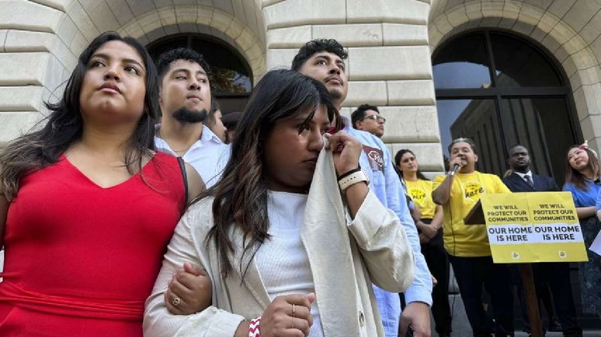 In New Orleans on Thursday, appellate judges heard arguments over a policy shielding certain immigrants from deportation. Wendy Reynoso, 24, whose immigration application remains in limbo, wipes away tears at a rally outside the court.