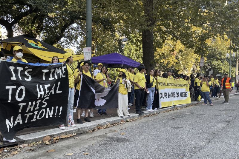 Demonstrators supporting Biden Administration efforts to protect immigrants brought to the U.S. illegally when they were children hold signs in front of the federal appeals court in New Orleans on Thursday.