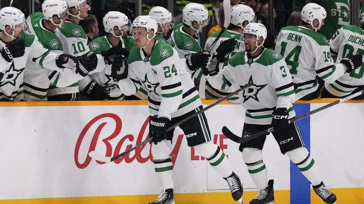 Dallas Stars center Roope Hintz (24) celebrates his goal with teammates during the second period of an NHL hockey game against the Nashville Predators, Thursday, Oct. 10, 2024, in Nashville, Tenn.