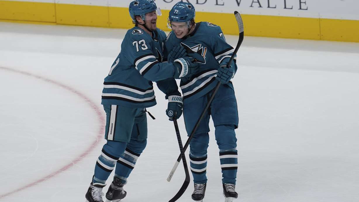 San Jose Sharks' Tyler Toffoli, left, celebrates with Macklin Celebrini, right, after scoring during the first period of an NHL hockey game against the St. Louis Blues, Thursday, Oct. 10, 2024, in San Jose, Calif.