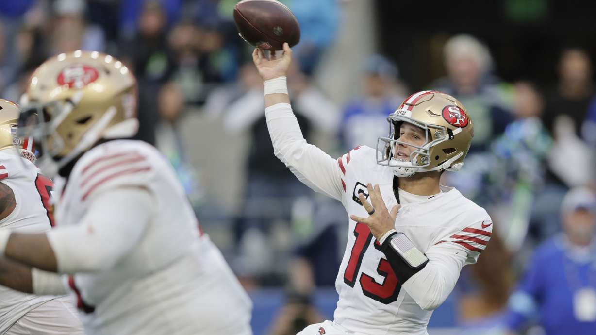 San Francisco 49ers quarterback Brock Purdy throws during the first half of an NFL football game against the Seattle Seahawks, Thursday, Oct. 10, 2024, in Seattle.