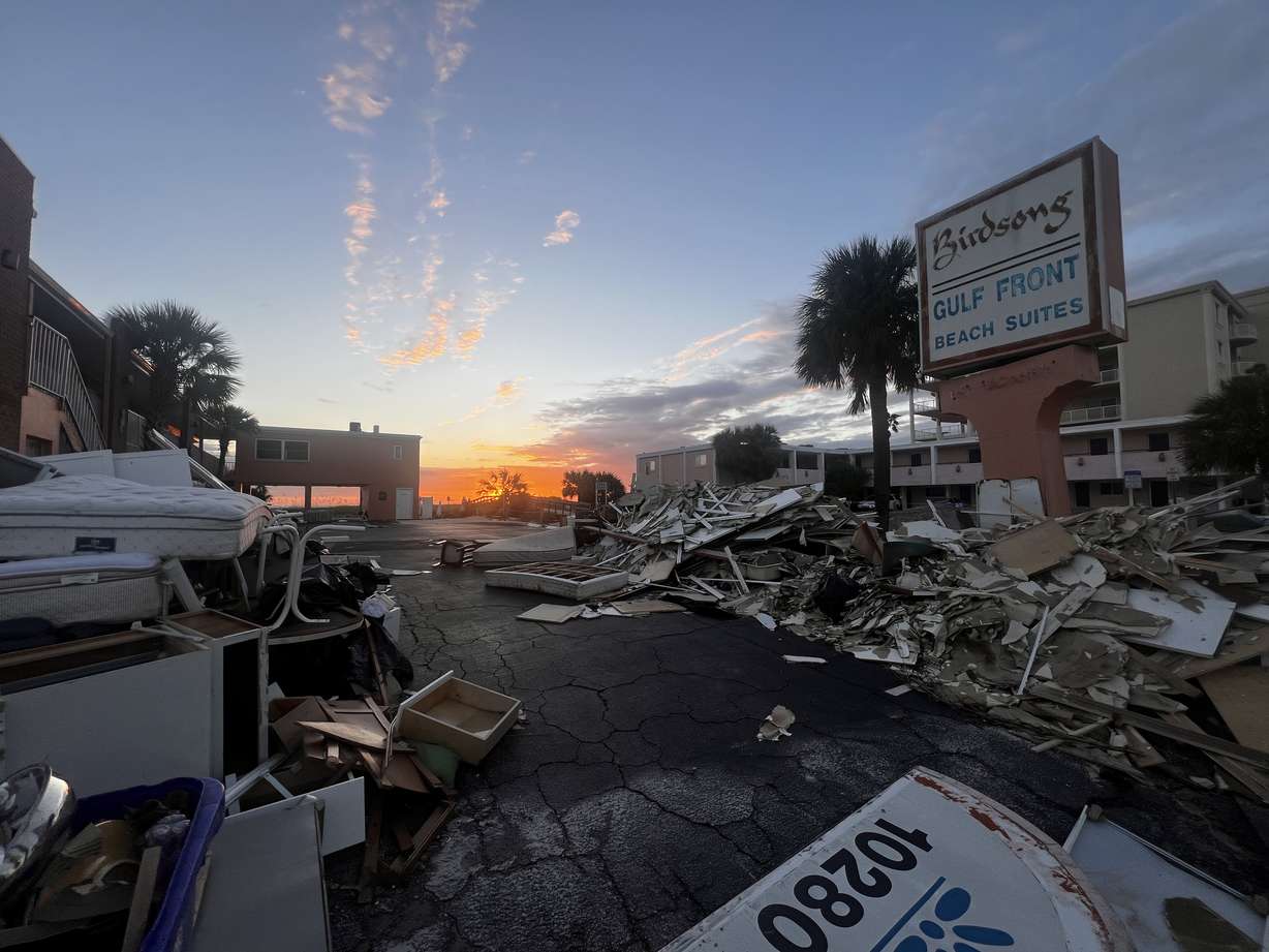 Hurricane Milton turned the parking lot of Travis Bonino’s condo complex into a debris field, shown Thursday in Treasure Island, Florida. Bonino's Utah restaurant is collecting donations.
