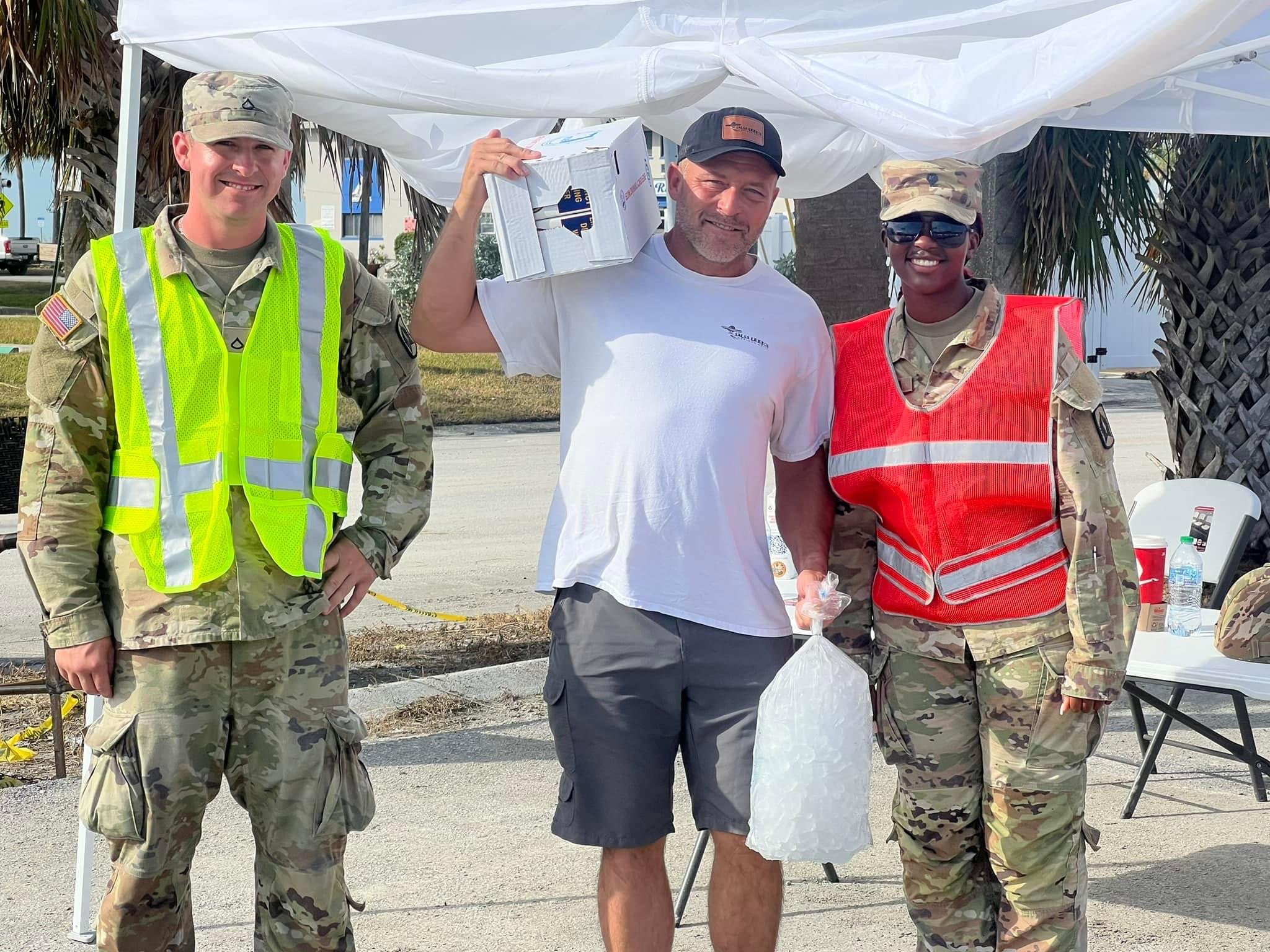 Travis Bonino, center, will stay in Florida as he coordinates the arrival of supplies from Utah.