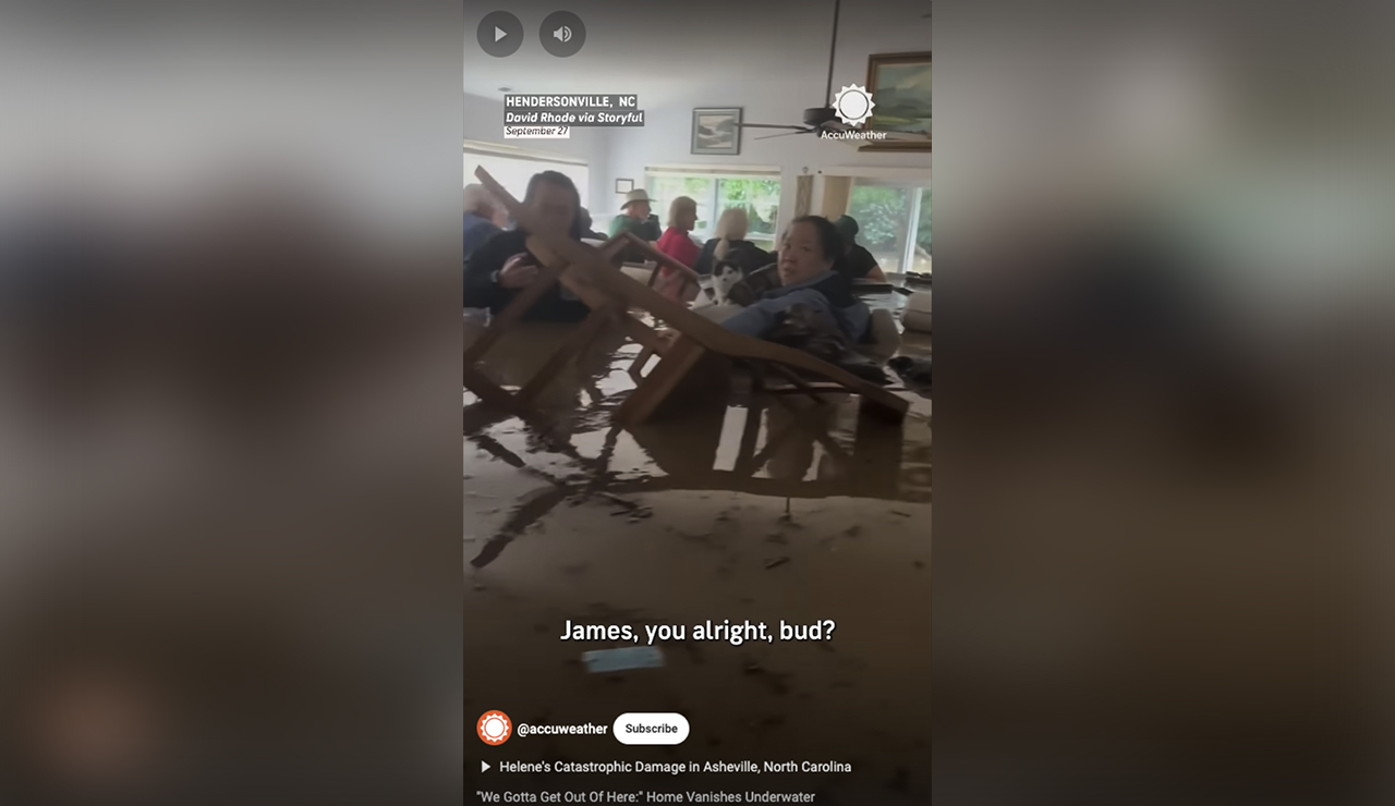 Neighbors gather in a Henderson, North Carolina, home that was flooded by Hurricane Helene-triggered rain on Sept. 27.