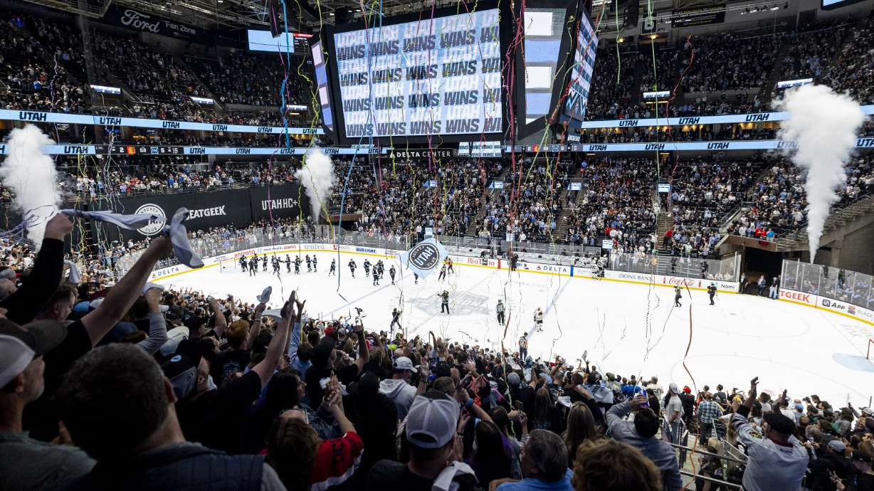 Fans celebrate after the Utah Hockey Club defeated the Chicago Blackhawks after a game held at the Delta Center in Salt Lake City on Tuesday, Oct. 8, 2024.
