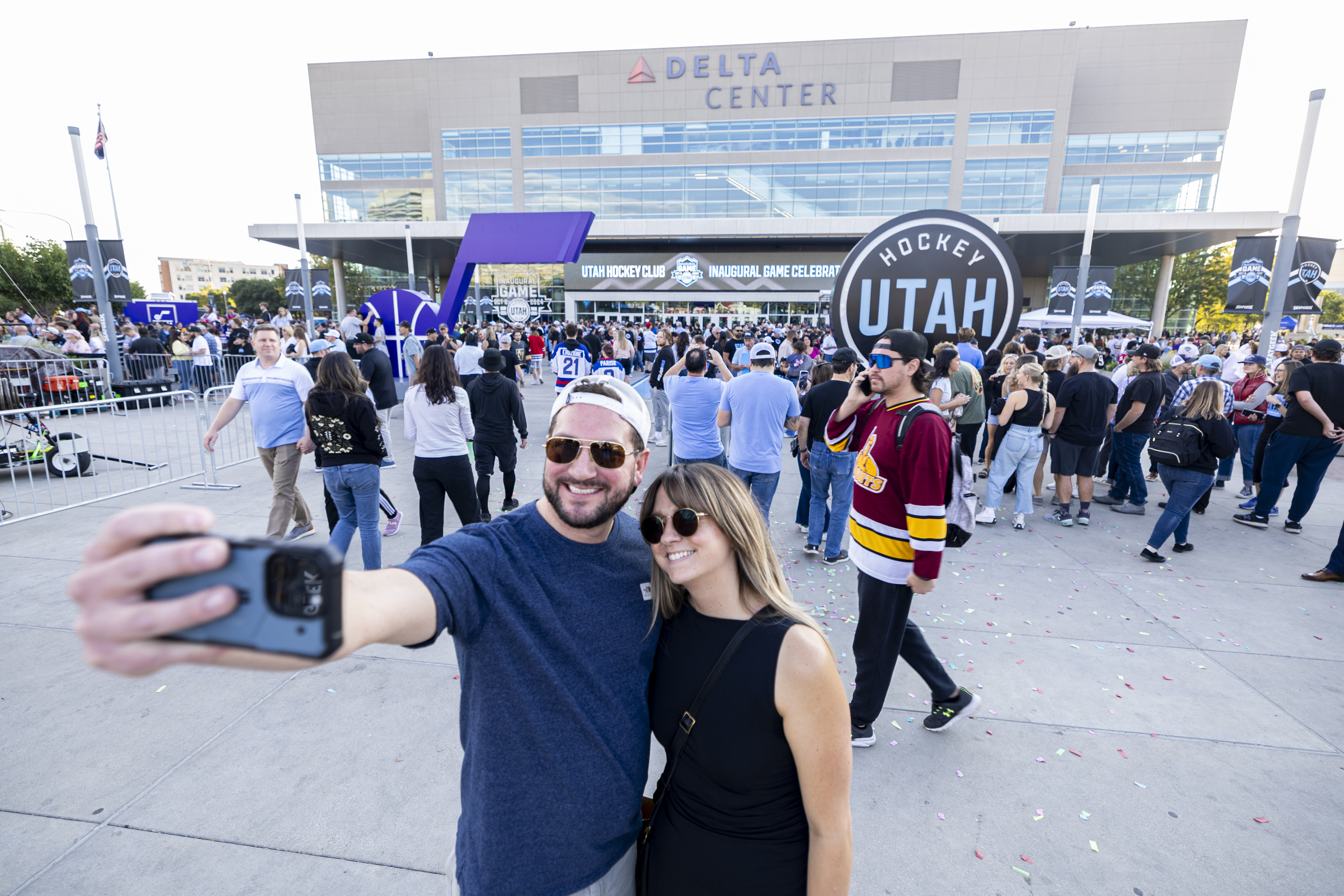 Jake May and Mary Kate Garland, both of Salt Lake City, pose together for a selfie before the Utah Hockey Club’s first-ever regular season NHL game held against the Chicago Blackhawks at the Delta Center in Salt Lake City on Tuesday, Oct. 8, 2024.