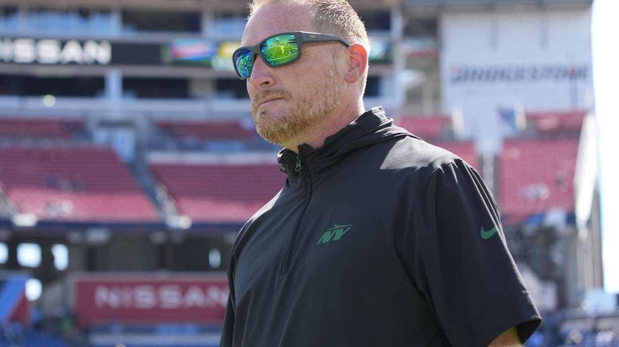 FILE - New York Jets passing game coordinator Todd Downing walks the field before an NFL football game against the Tennessee Titans, Sunday, Sept. 15, 2024, in Nashville, Tenn.