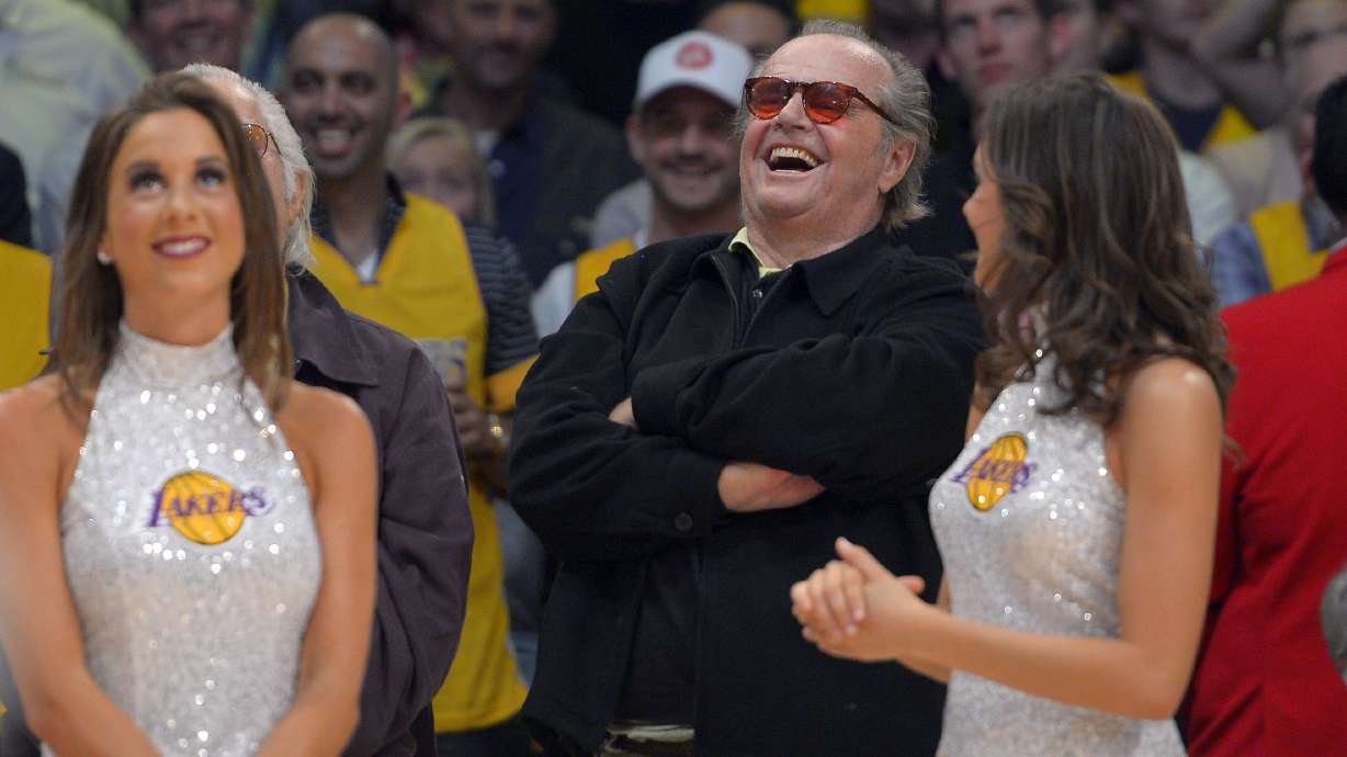 FILE - Actor Jack Nicholson laughs at former Los Angeles Lakers center Shaquille O'Neal as they retire his jersey during halftime of the Lakers' NBA basketball game against the Dallas Mavericks, Tuesday, April 2, 2013, in Los Angeles.