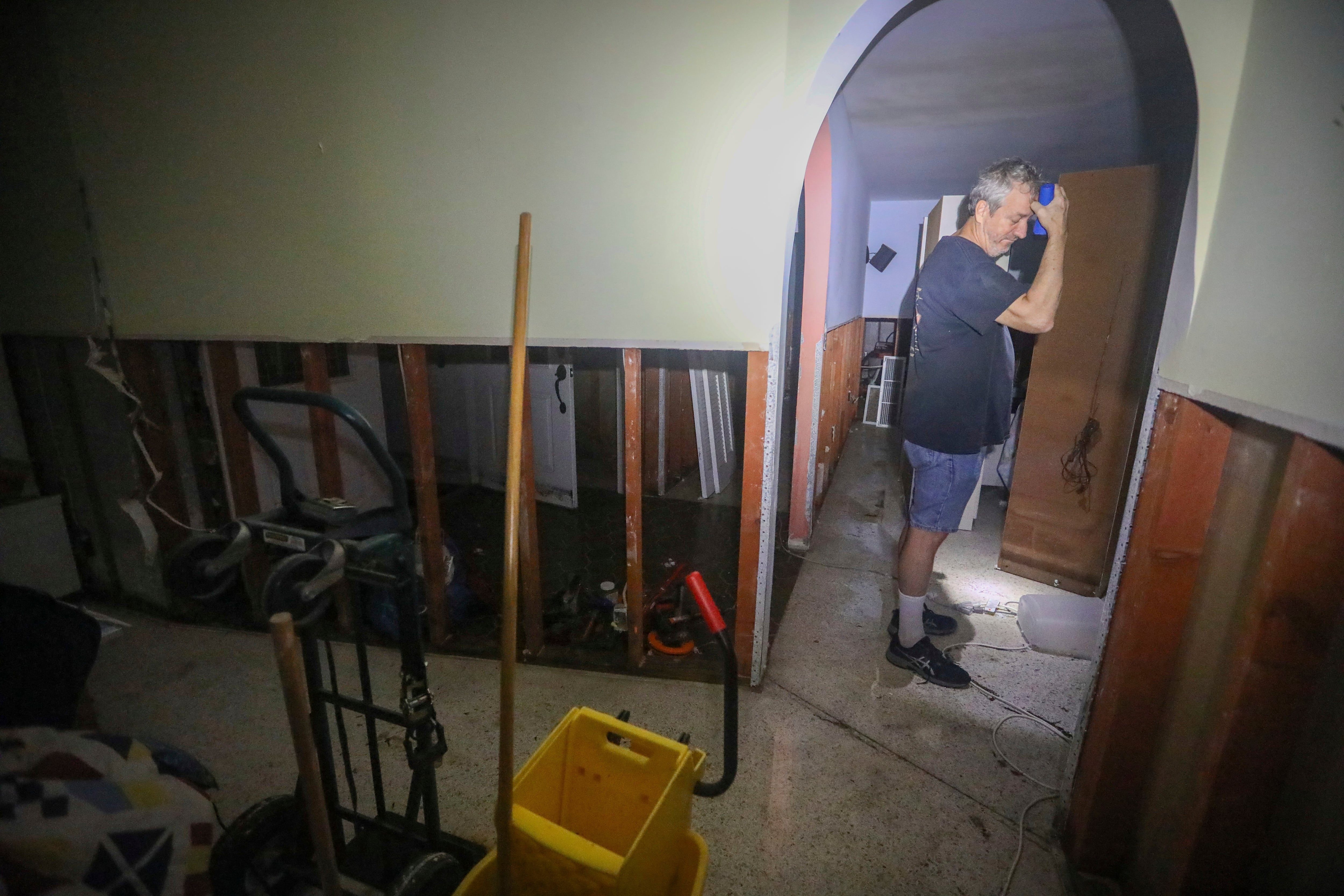 Doug Manning surveys damage to his Siesta Key, Fla., home after Hurricane Milton made landfall nearby, Thursday.