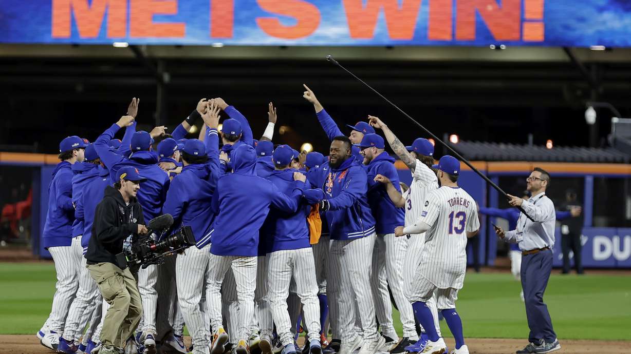 The New York Mets celebrate after defeating the Philadelphia Phillies in Game 4 of the National League baseball playoff series, Wednesday, Oct. 9, 2024, in New York.