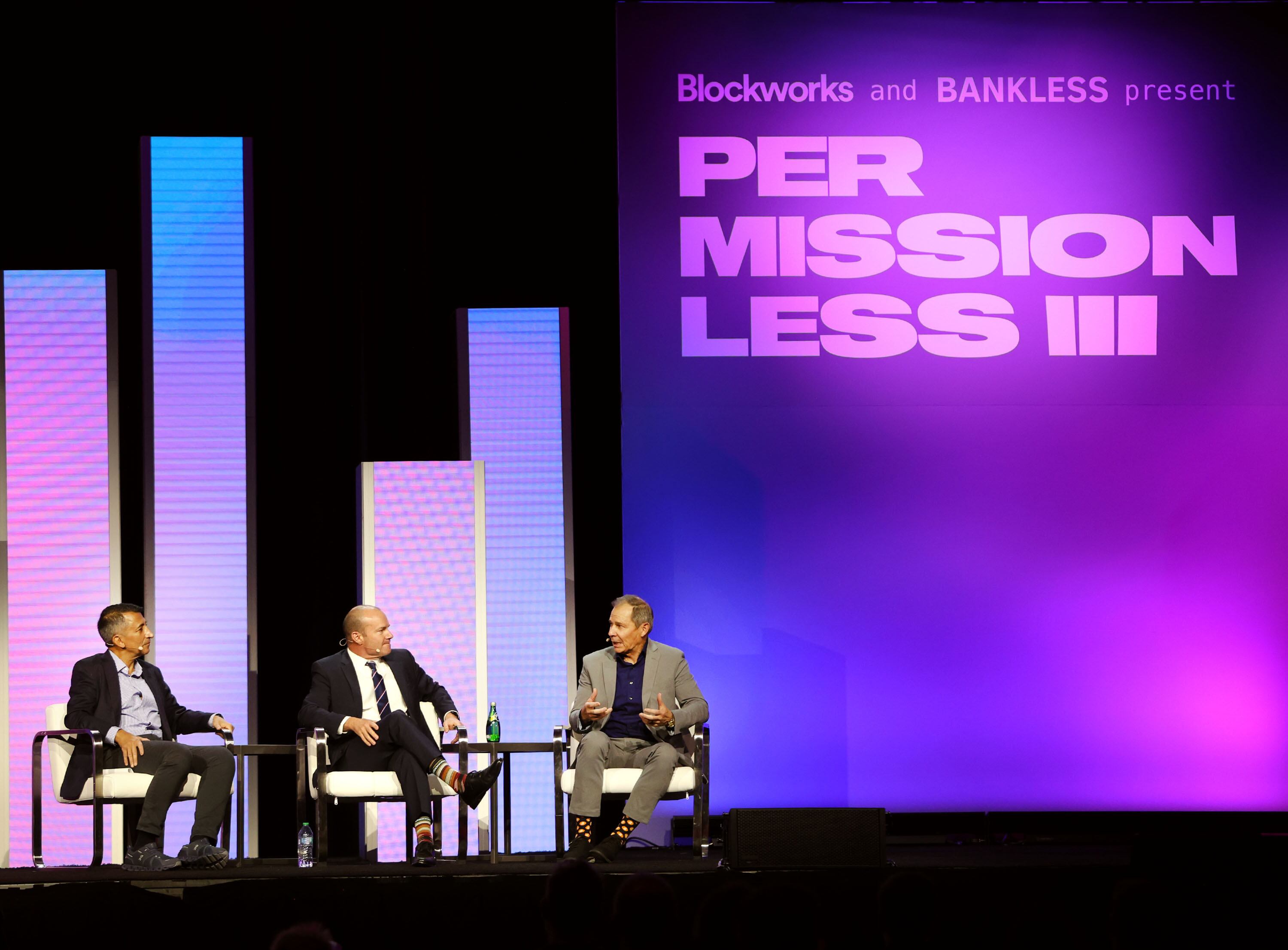 Faryar Shirzad, chief policy officer at Coinbase, Sen. Mike Lee, R-Utah, and Rep. John Curtis, R-Utah, speak at the “Utah: The Frontier of Digital Asset Innovation" event during the Permissionless conference at the Salt Palace Convention Center in Salt Lake City on Friday.