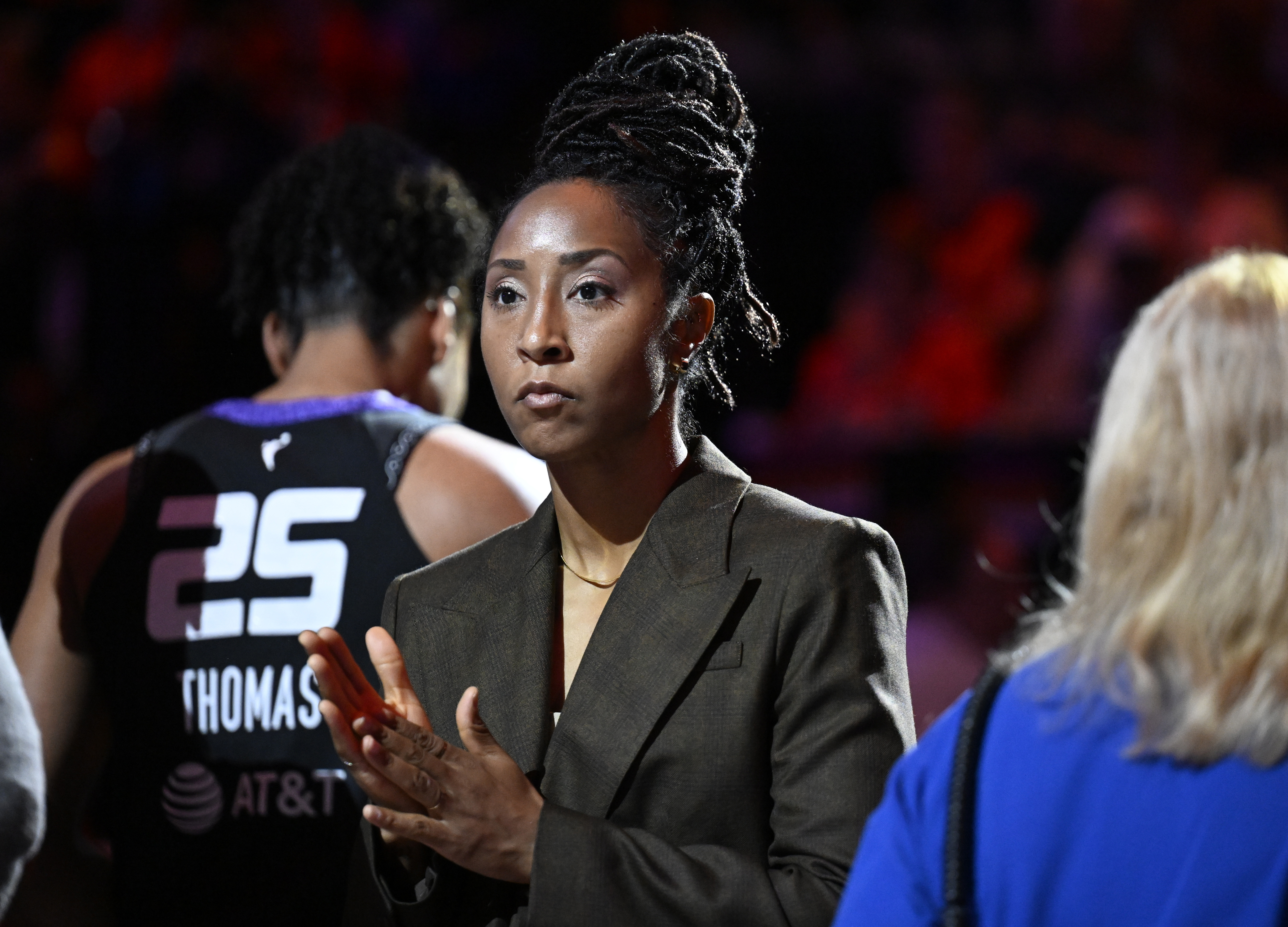 FILE - Connecticut Sun assistant coach Briann January at the start of a WNBA basketball semifinal game against the Minnesota Lynx, Oct. 4, 2024, in Uncasville, Conn.