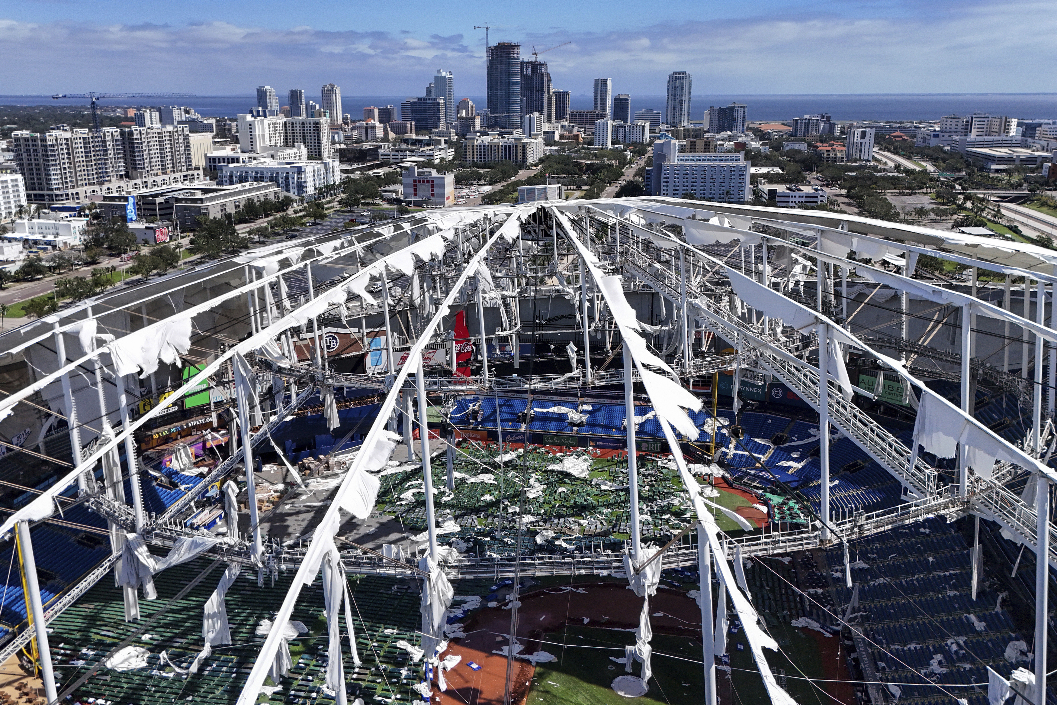 FILE - The roof of the Tropicana Field is damaged the morning after Hurricane Milton hit the region, Oct. 10, 2024, in St. Petersburg, Fla.