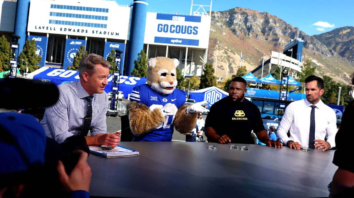 From left, Rob Stone, Cosmo the Cougar, Mark Ingram II and Matt Leinart rehearse for tomorrow’s Big Noon Kickoff show at LaVell Edwards Stadium in Provo on Friday, Oct. 11, 2024. No. 14 BYU will host Arizona in the Cougars’ annual homecoming game tomorrow at 2 p.m. MDT on FOX.